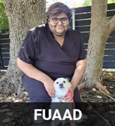 Fuaad with a Small White Dog